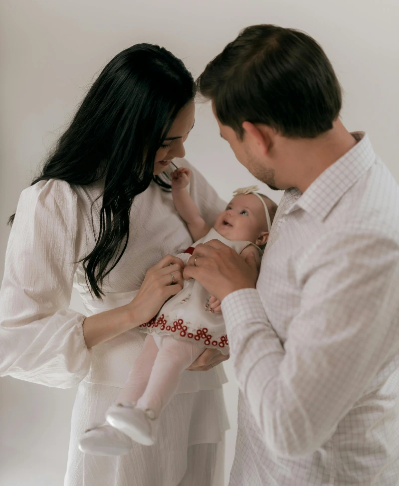 Couple holding their baby
