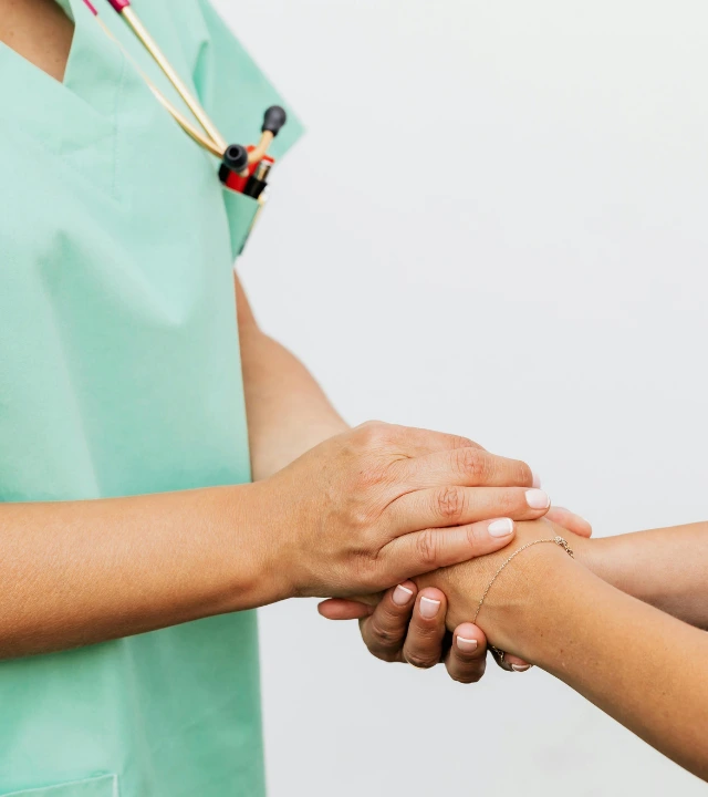 A doctor and a patient doing handshake